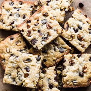 Stack of chocolate chip walnut blondies.