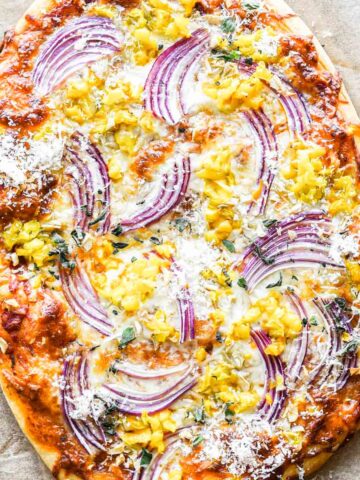 Close up image of pizza fresh out of the oven.