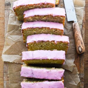 Slices of blood orange cake on a cutting board.
