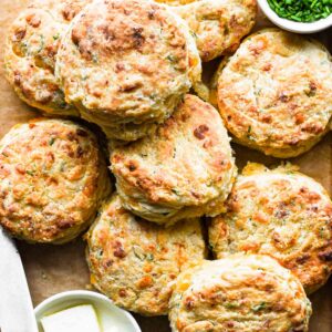 Close up shot of a stack of cheddar chive biscuits.
