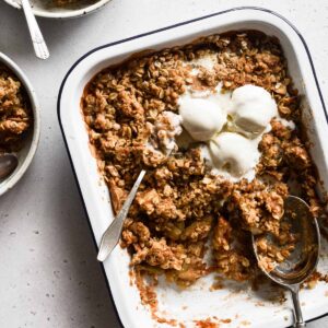Apple crisp close up with ice cream.