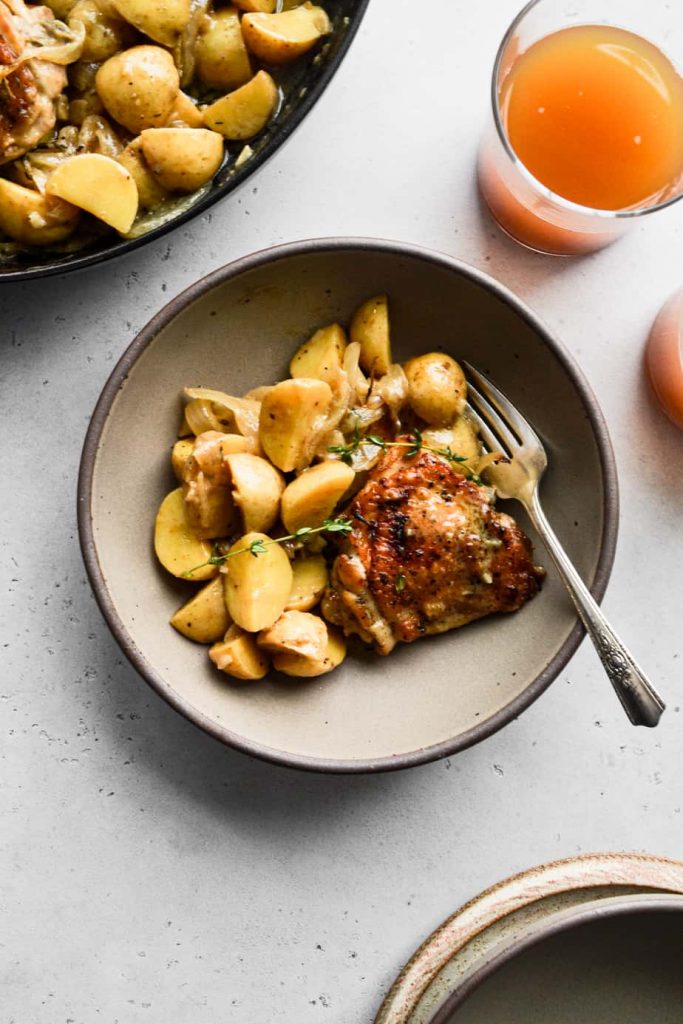 Apple Cider Braised Chicken Thighs In a Bowl