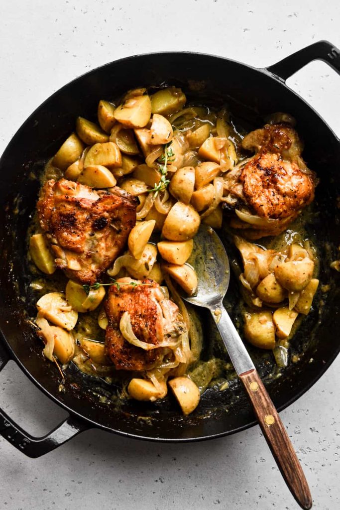 Apple Cider Braised Chicken Thighs Being Served