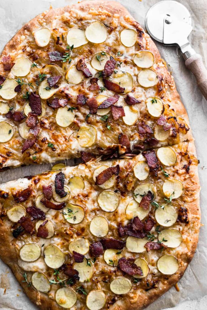 Caramelized Onion and Bacon Pizza sliced in half