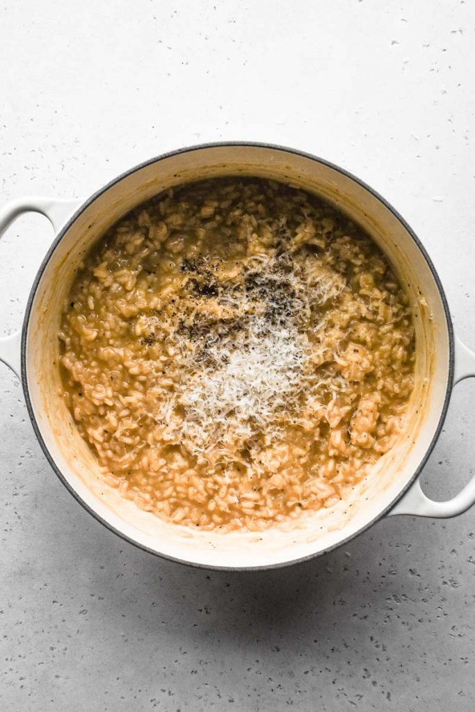 Cacio e Pepe Risotto Close Up with Cheese and Pepper