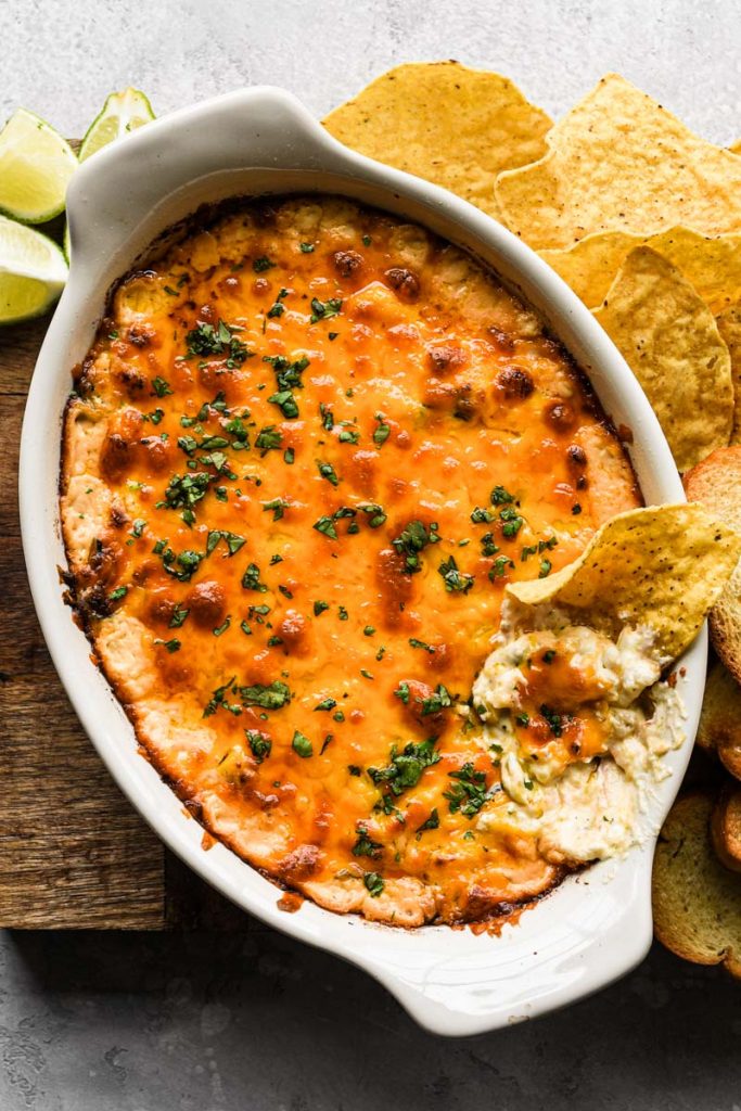 Up close of dip with a tortilla chip in it