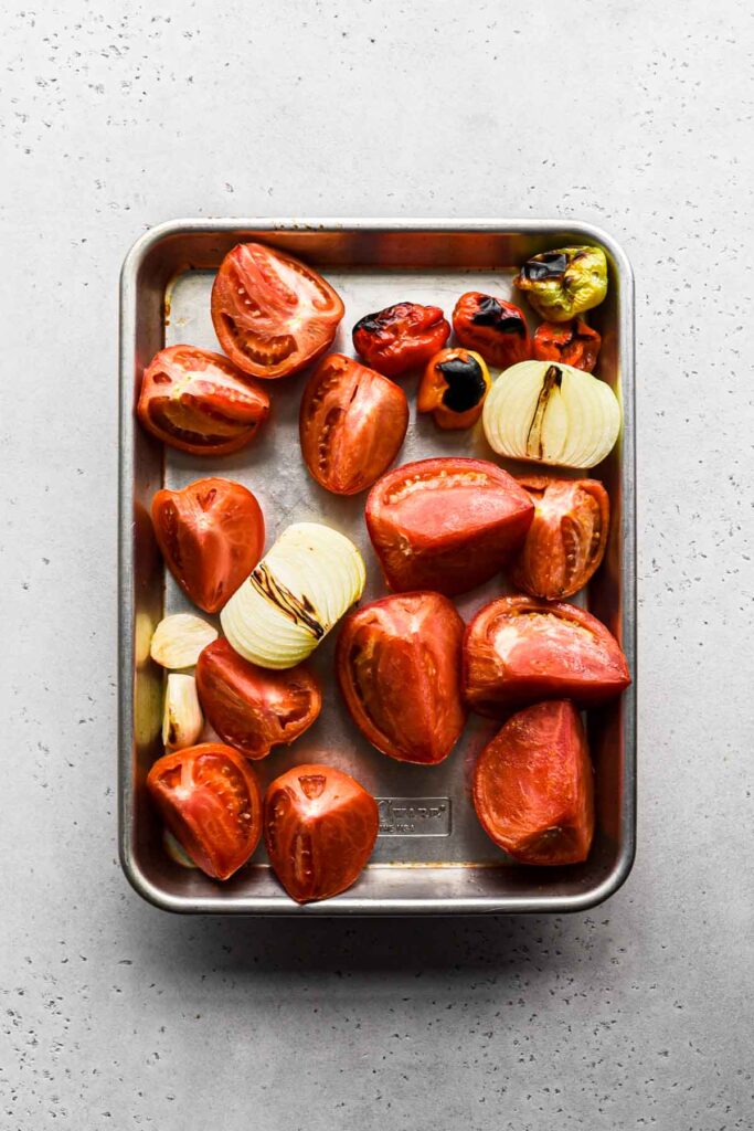 Tomatoes, onion, garlic, peppers after being broiled.