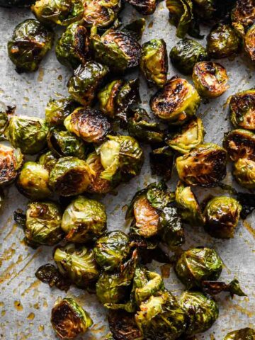 Thumbnail image of honey sriracha brussels sprouts on a sheet tray.