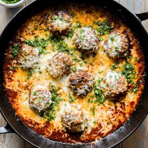 Chicken parmesan meatballs in a skillet freshly baked.
