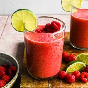 Frozen Raspberry Margaritas in a glass.