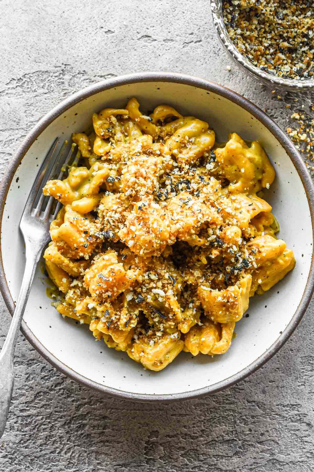 Bowl of pasta with sage breadcrumbs on top.