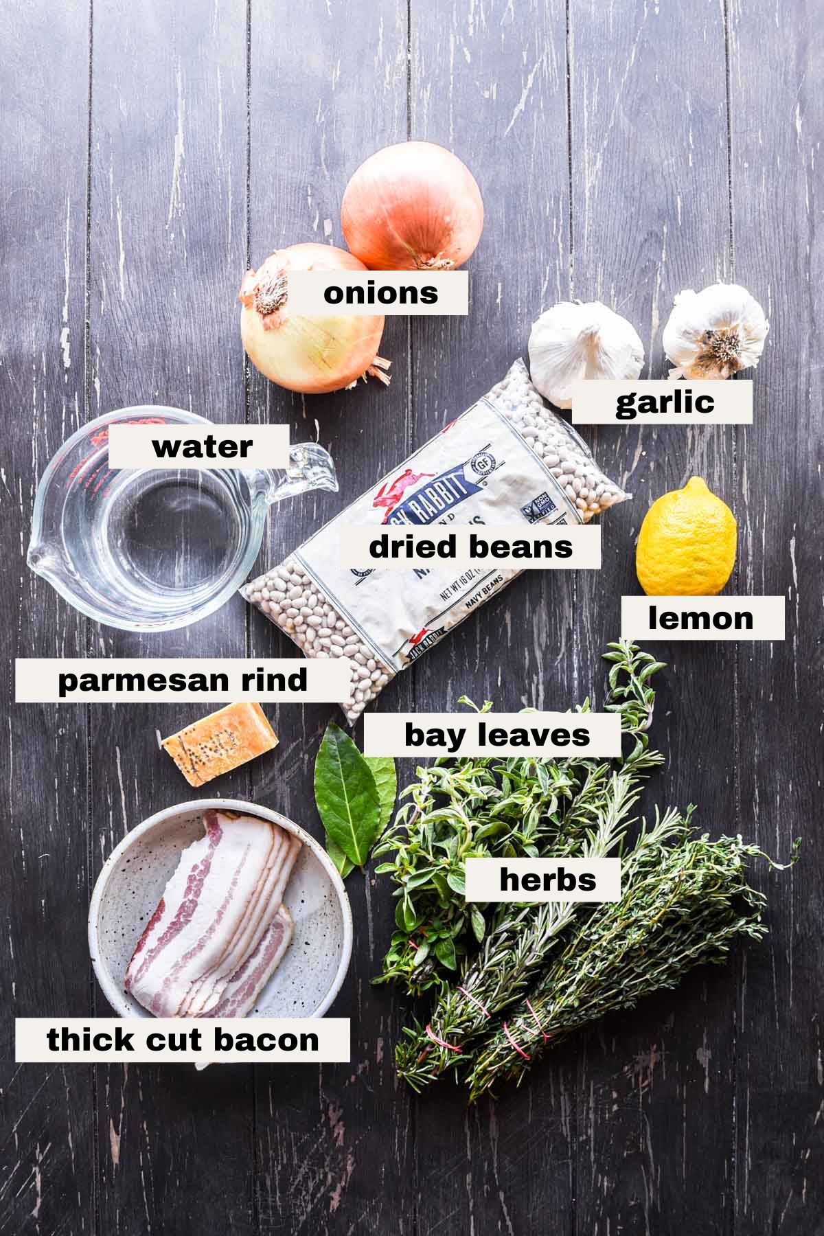 ingredients on a table that are needed to make brothy beans.