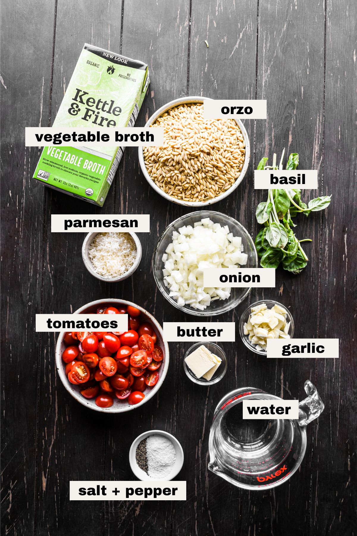 Ingredients for Orzo with Tomatoes on a table.