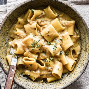 Finished french onion pasta in a bowl.