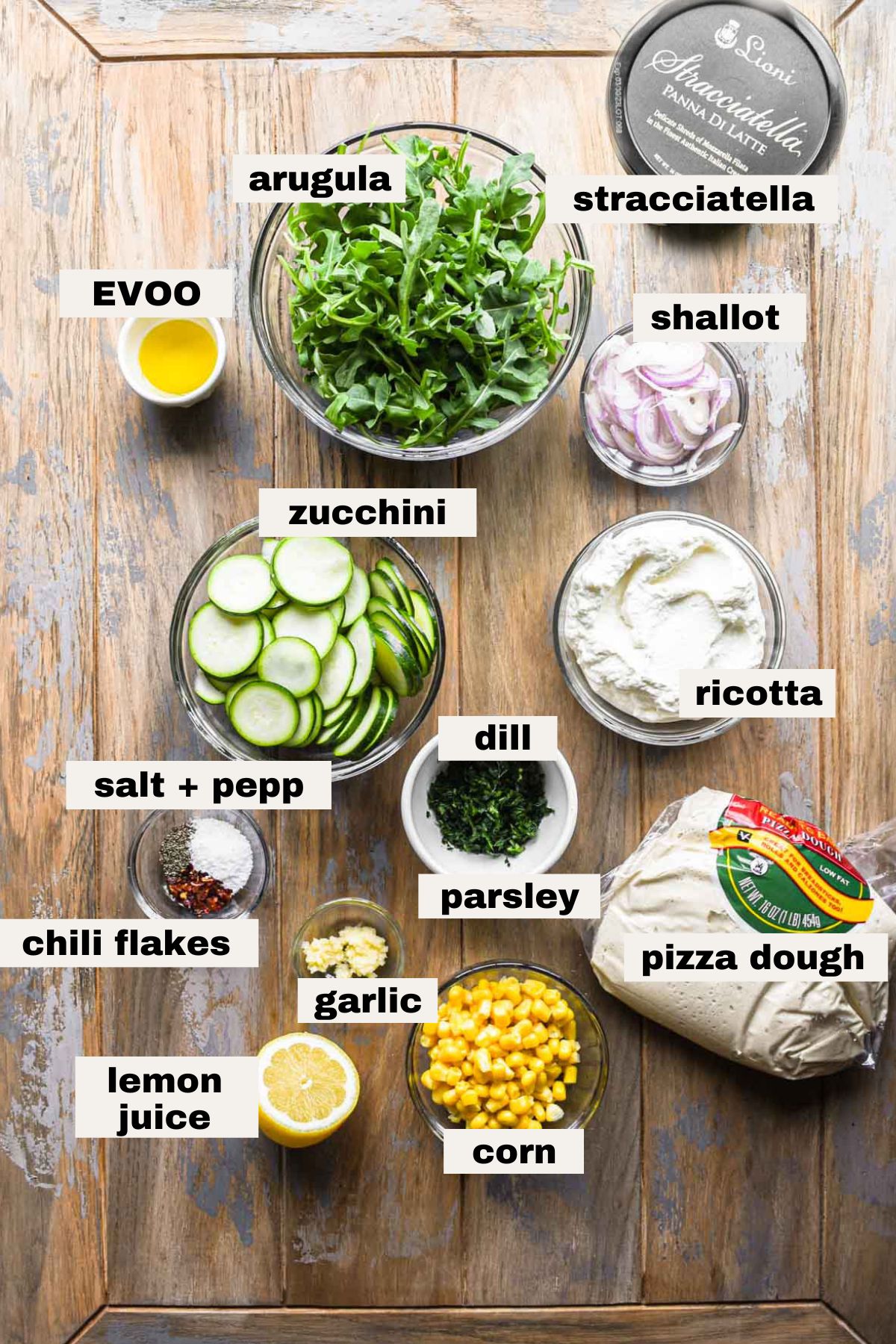 Ingredients needed for spring zucchini and stracciatella pizza.