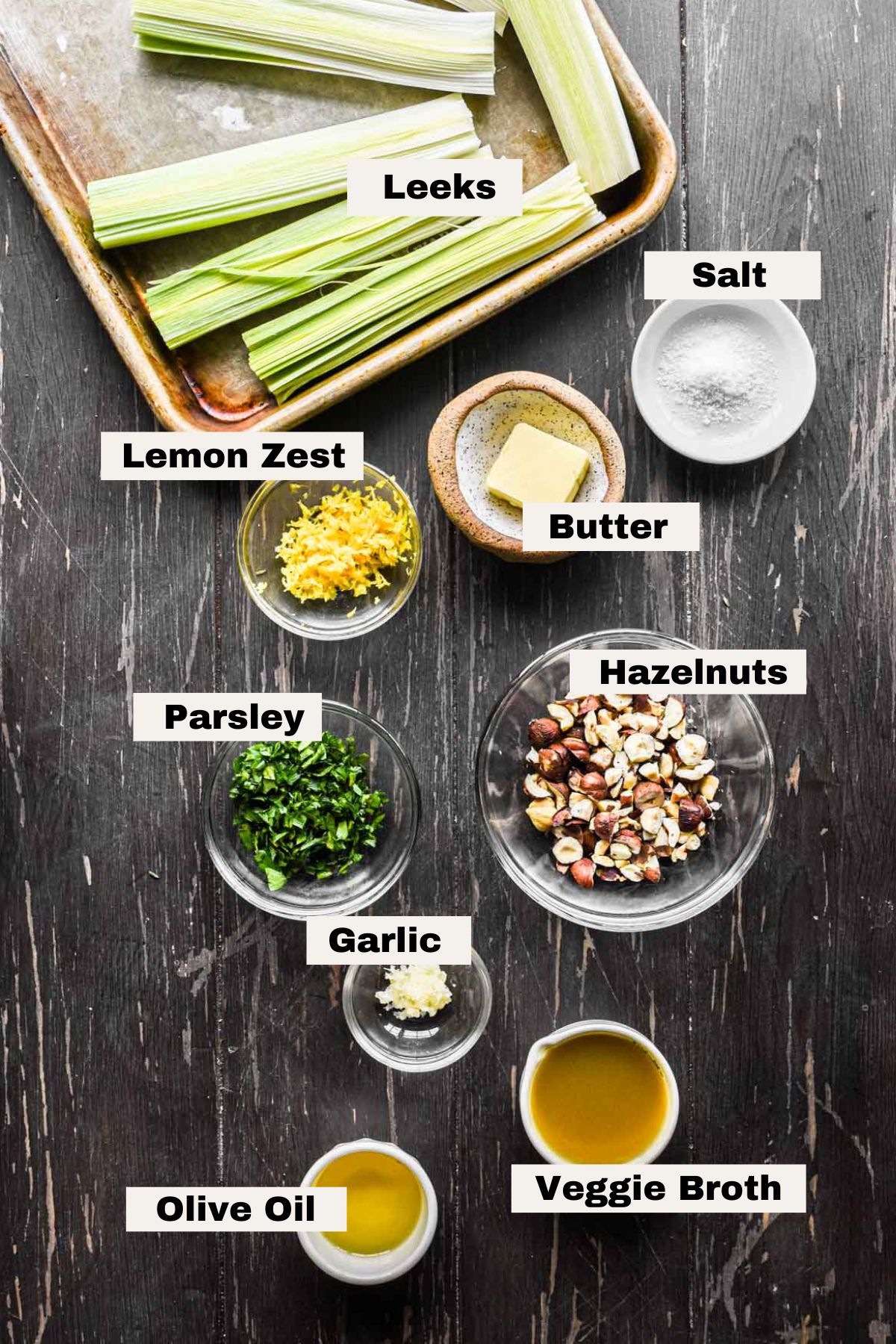 Labeled ingredients on a table needed for this dish.