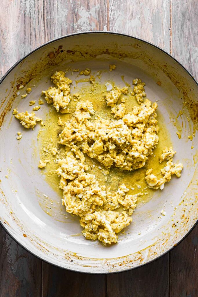 Scrambled eggs in a skillet.