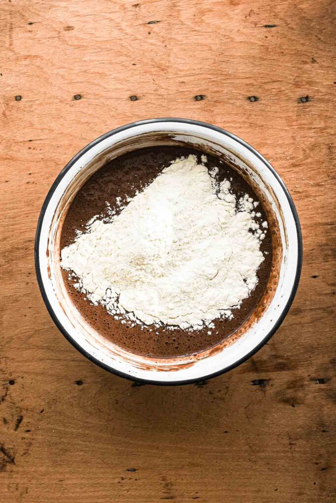 Adding flour.