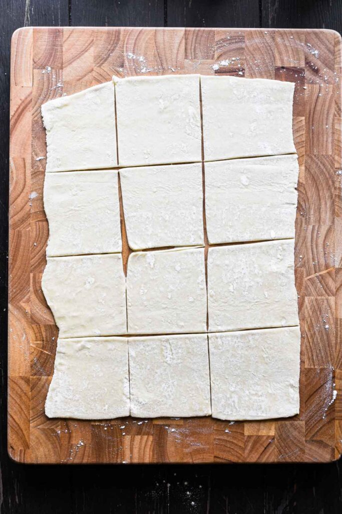 Rolling out and slicing the puff pastry.