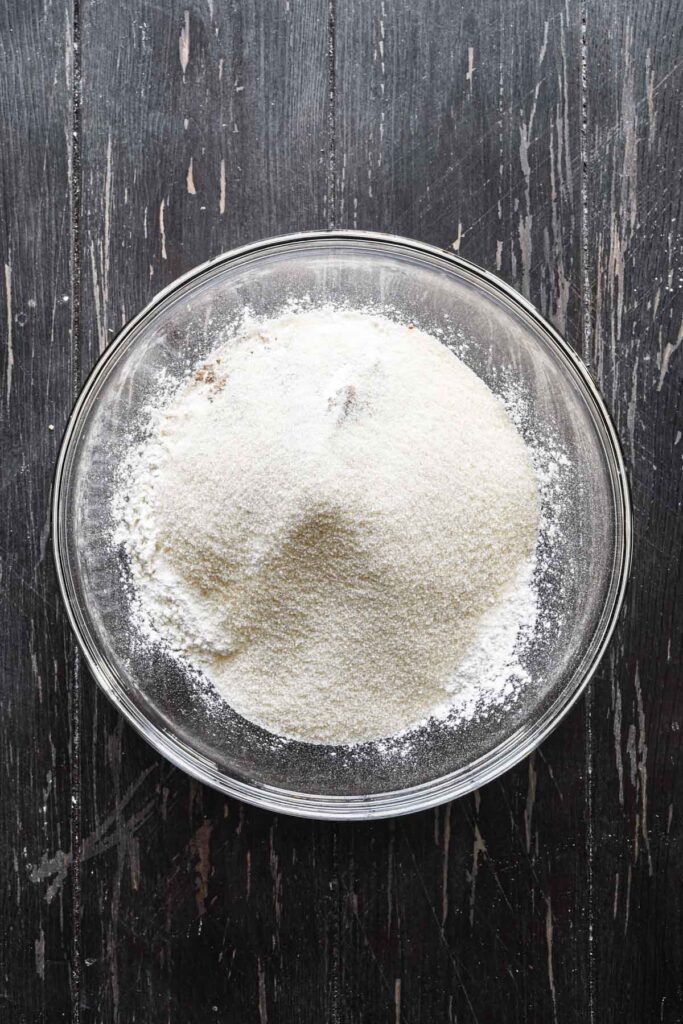 Mixing together dough ingredients.