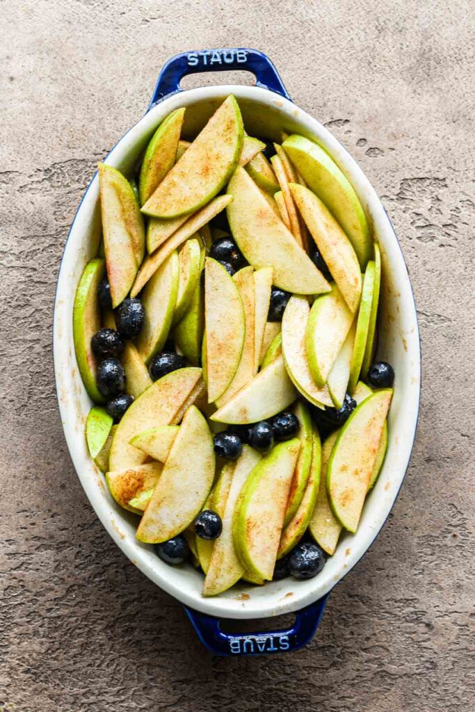 Filling in an oval baking dish.