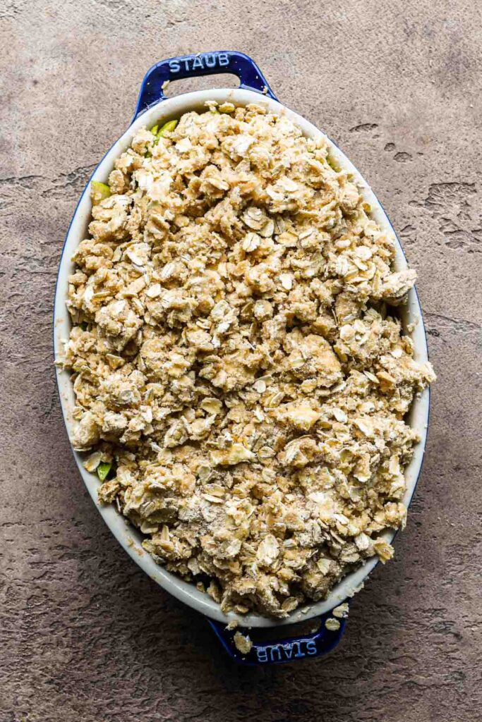 Crumble in the baking dish before baking.