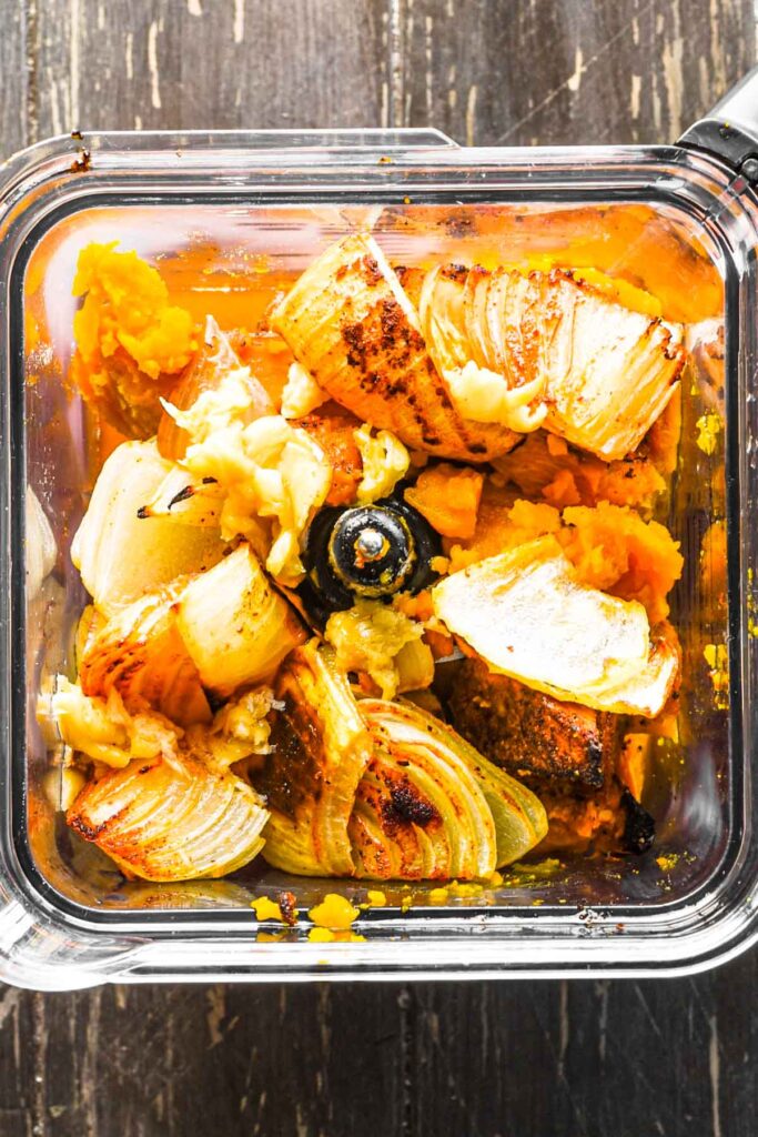 Roasted vegetables and stock in blender.