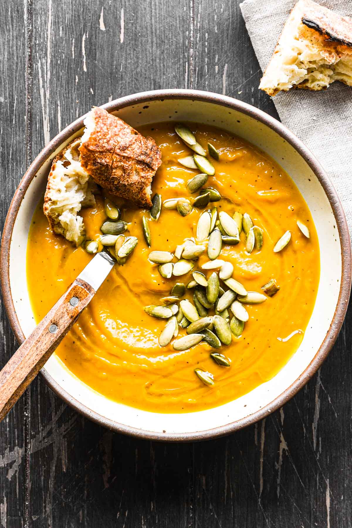 Finished bowl of roasted kabocha squash soup with pepitas.
