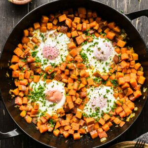 Sweet potato egg hash topped with chives.