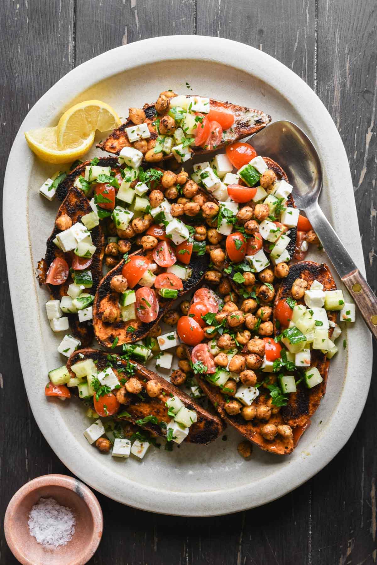 Finished mediterranean sweet potatoes on a serving tray.