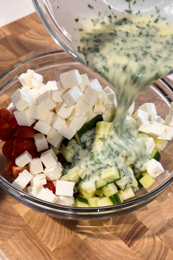Mixing dressing in.