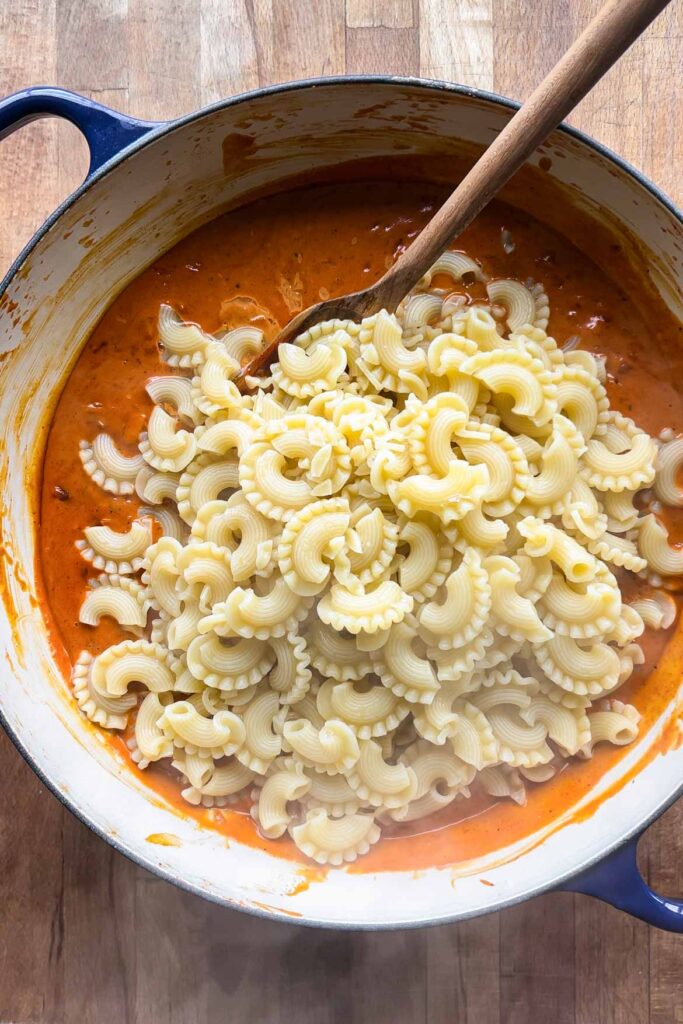 Adding pasta.