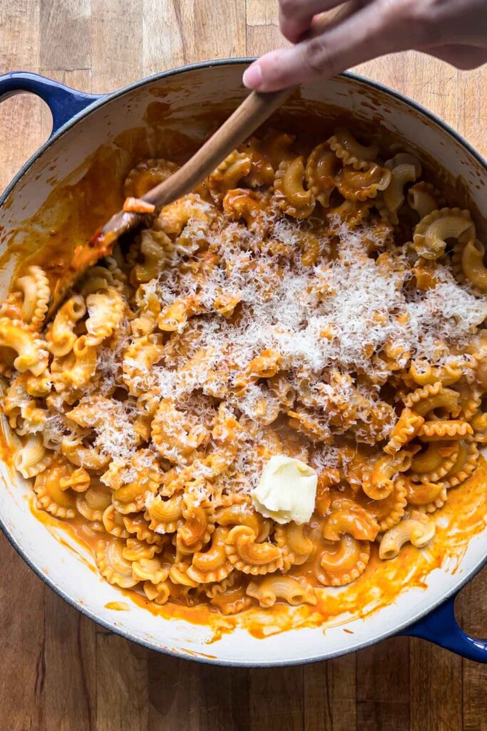 Adding parmesan and butter.