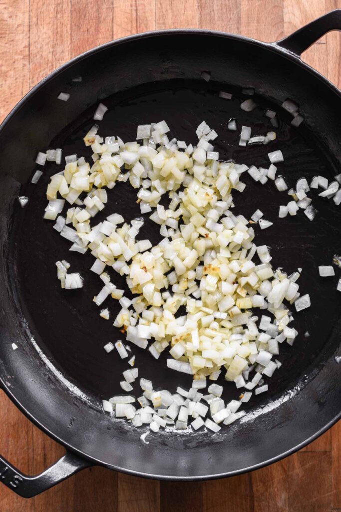 Cooking the onion in a skillet.