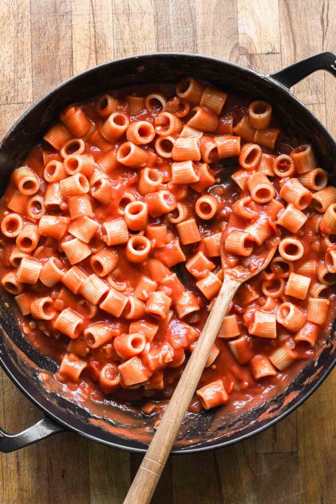 Rigatoni added into the homemade sauce.