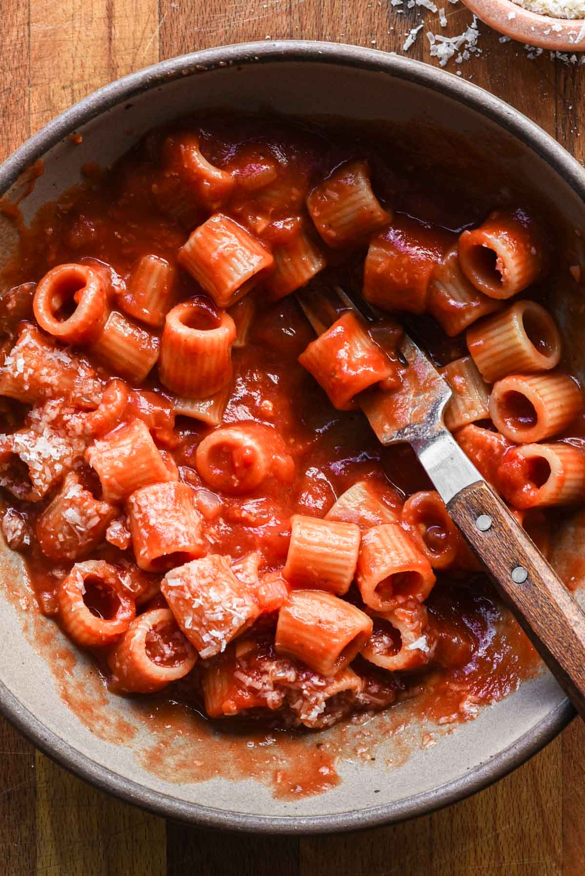 Bowl of pasta being eaten.