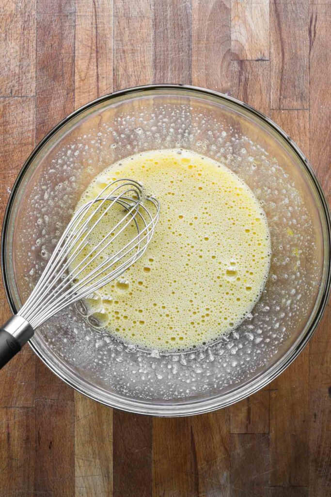 Whisking eggs and sugar.
