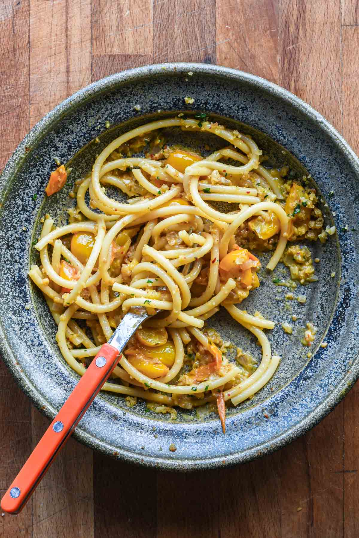 Finished bowl of pasta with a little left.