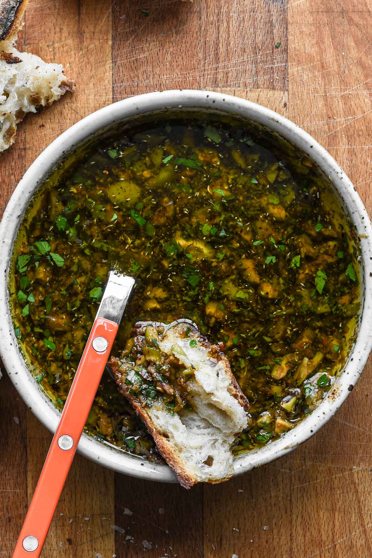 Balsamic and olive oil dip with bread dunked in.