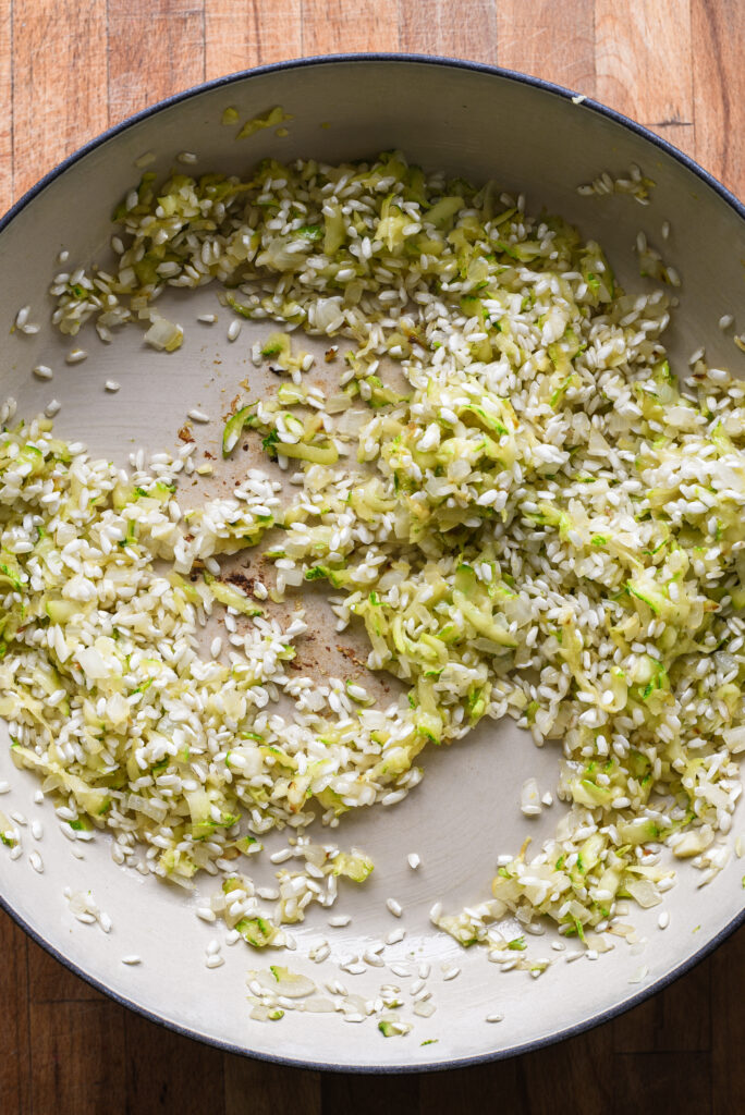 Adding the rice to toast.