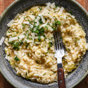 Risotto in a bowl with a fork.