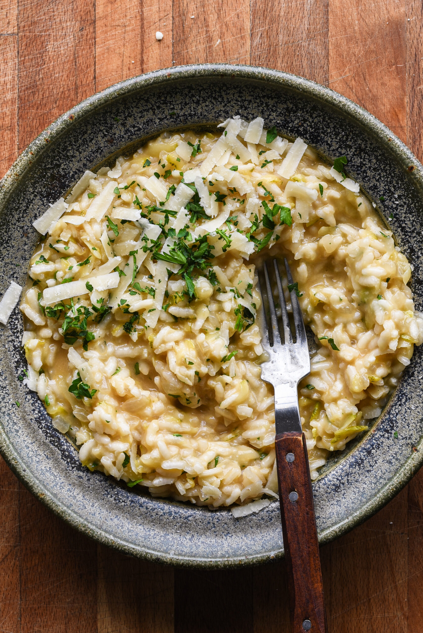 Risotto in a bowl with a fork.