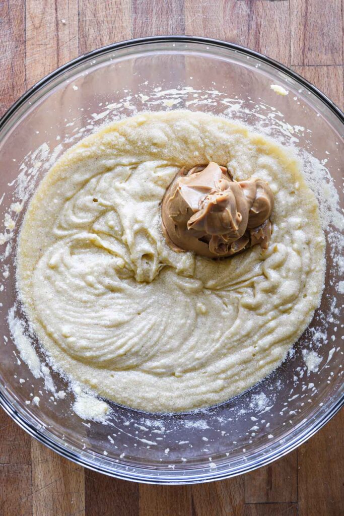 Adding peanut butter to wet ingredients.