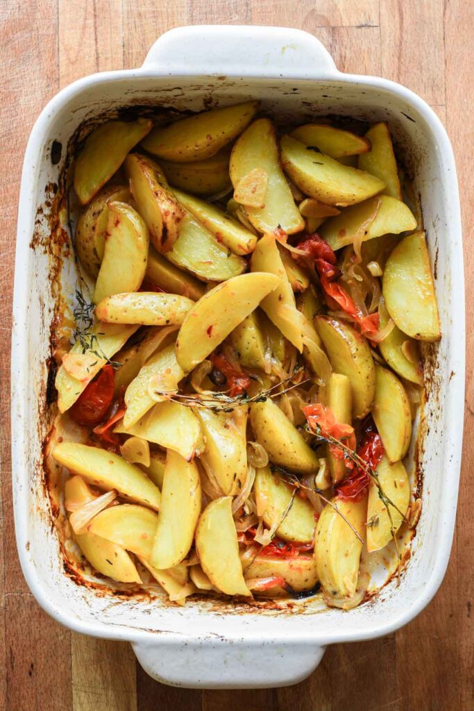 Roasted potatoes with tomatoes.