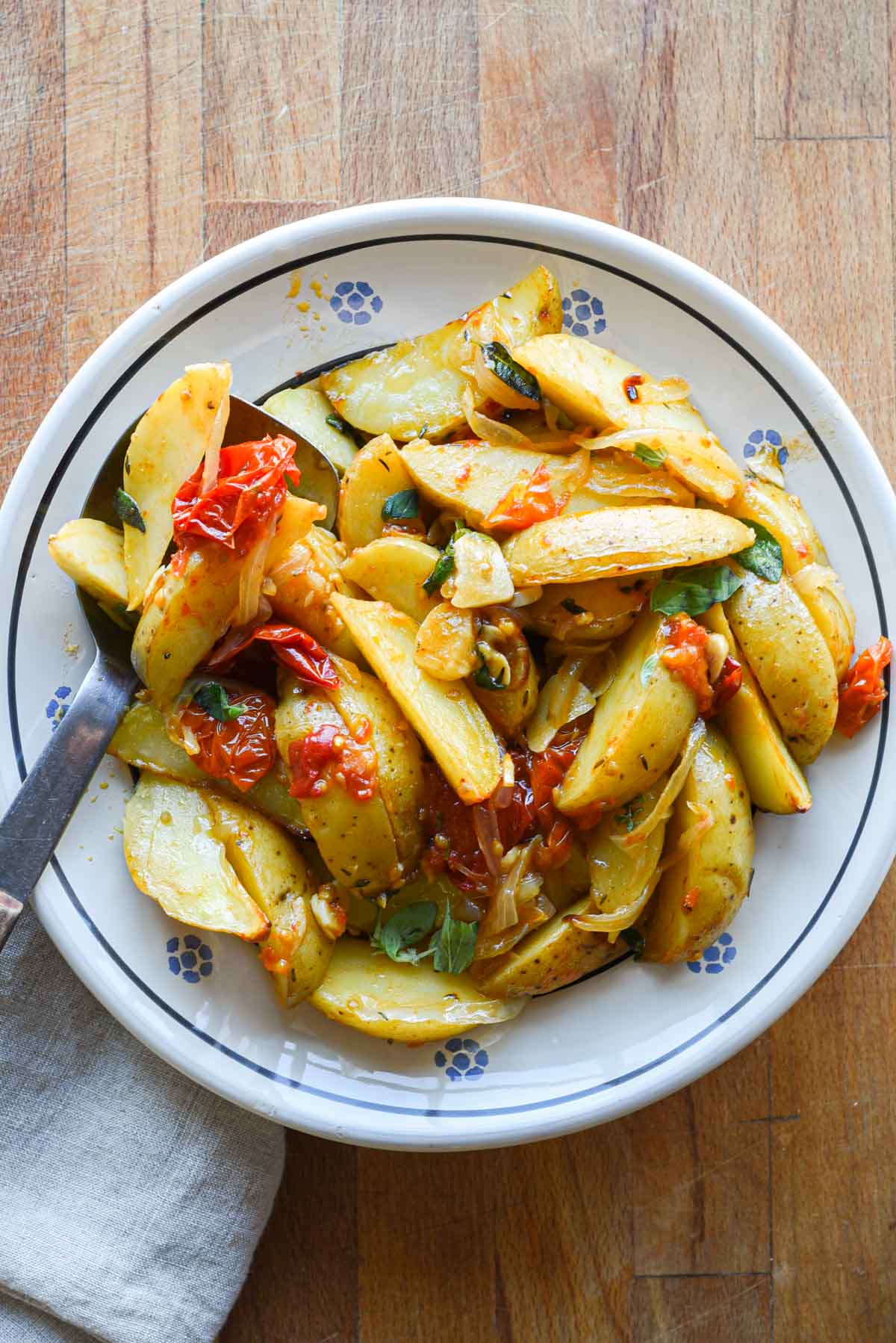 Finished roasted potatoes in a bowl for serving.