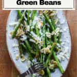 Garlic roasted green beans on serving plate.