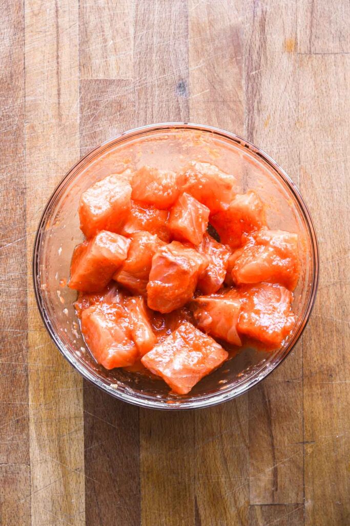 Salmon cubes with the sauce on top.