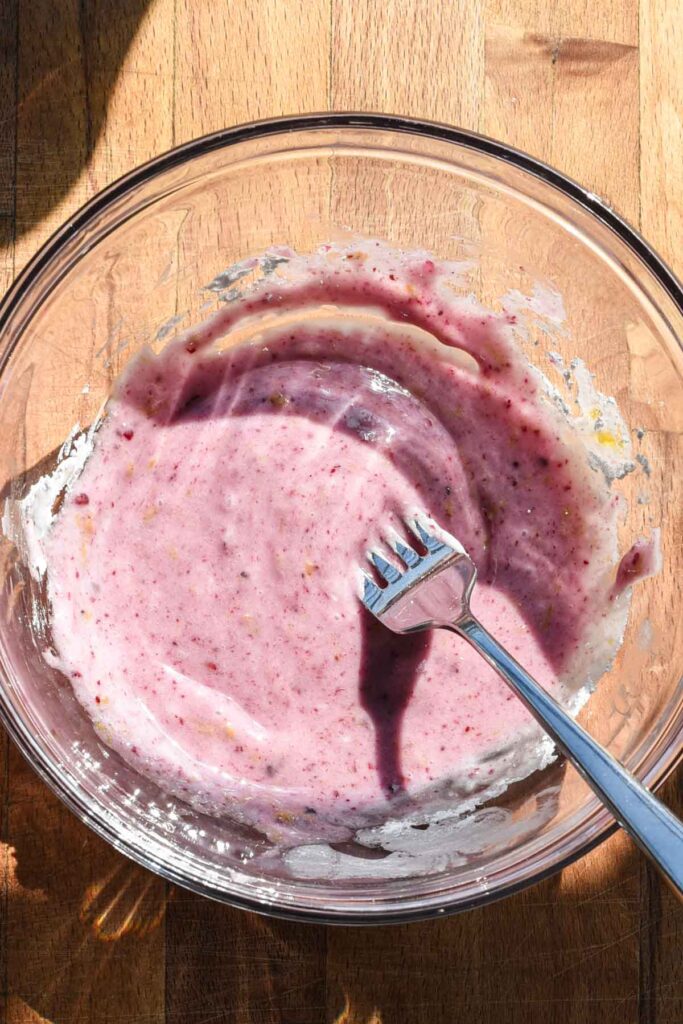 Icing in a clear glass bowl.