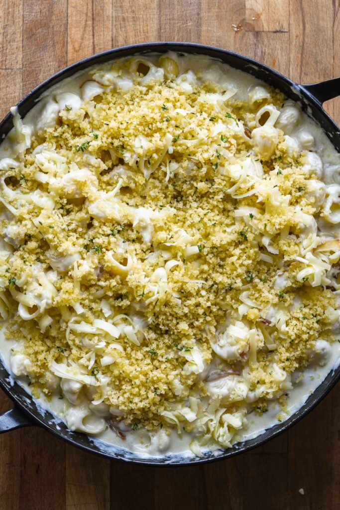 Bread crumbs on top of mac and cheese.
