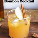 Finished cocktail with apple garnish.